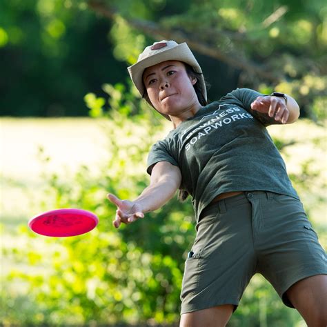 Tina Moore Disc Golfs forehand in Booty Shorts